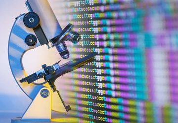 color coded DNA sequence on monitor with microscope